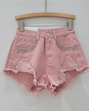 Shorts vaqueros deshilachados con incrustaciones de diamantes