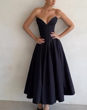 Vestido midi con tubo y corsé con cremallera plisada y bolsillos dobles